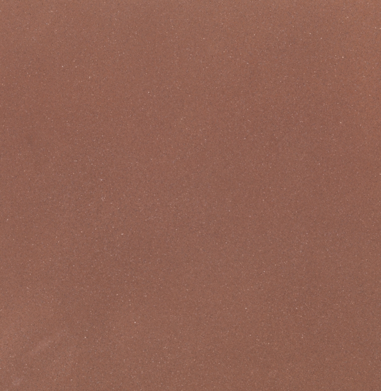 Texture sabbiata color terracotta della finitura Pavilux Sablée per pavimenti in calcestruzzo a basso spessore, ideale per superfici continue resistenti e moderne in interni ed esterni.